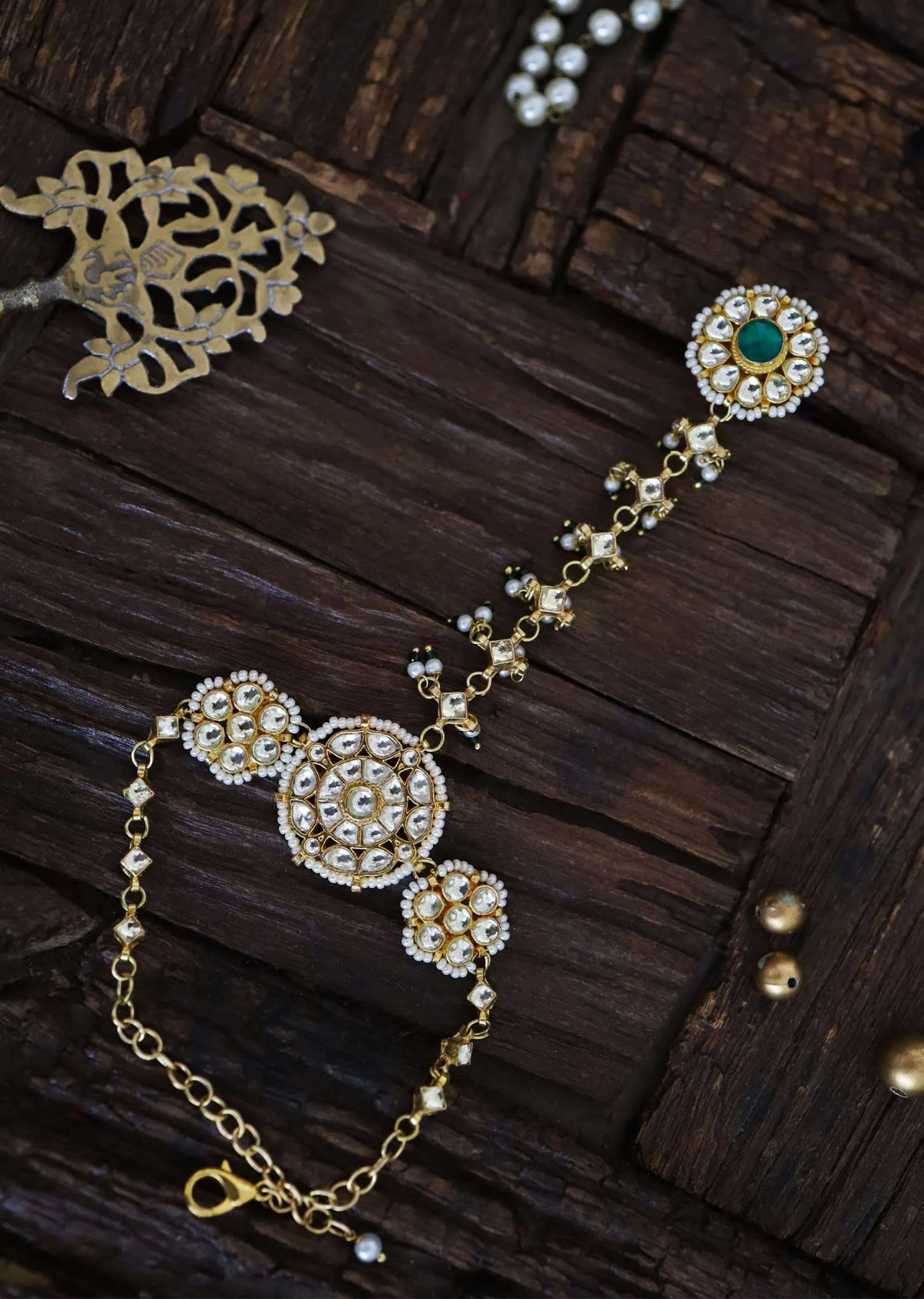 Gold Plated Kundan Haathphool Studded With Shell Pearls