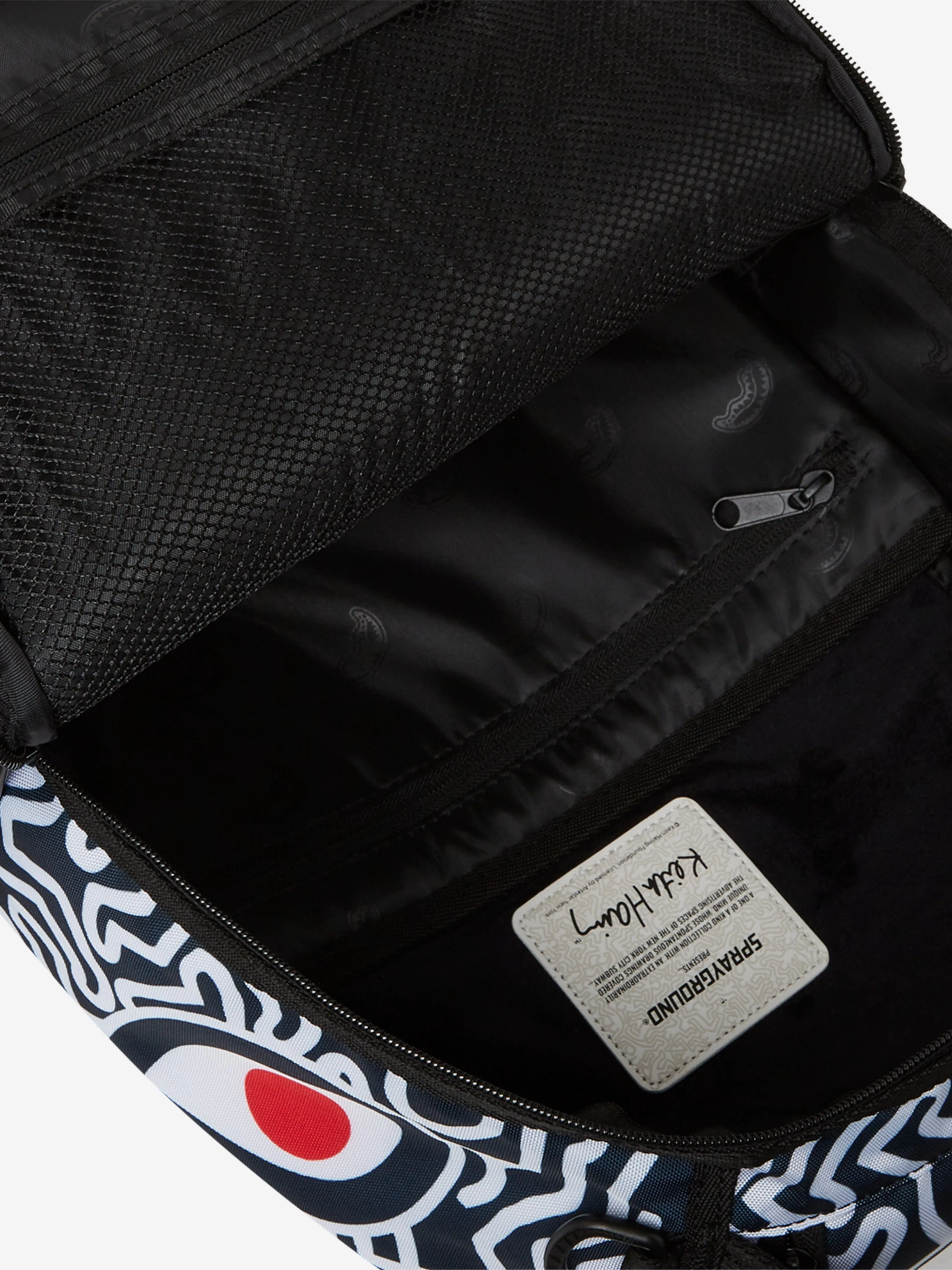 Sprayground Kids Keith Haring Skater Guy DLXSR Backpack in Black (45.72 cm)